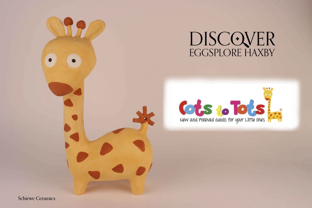 Schiewe Ceramics sculpture of a giraffe Cots to Tots logo.