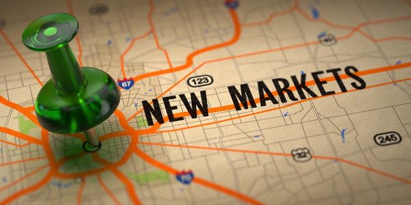 A green pushpin marks 'NEW MARKETS' on a map with roads and highways.