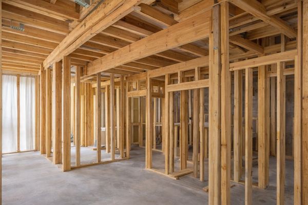 Interior view of a wooden frame structure under construction.