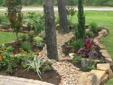 Custom paver walkway and stone path installation for a clean front yard design.