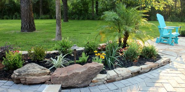 Professional residential landscaping with fresh sod, plants, and clean design in Houston