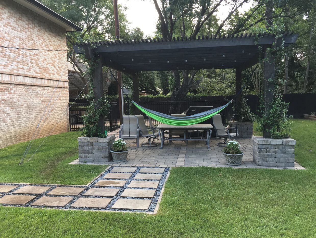 Backyard gazebo installation with patio and landscaping upgrades for a shaded outdoor space.