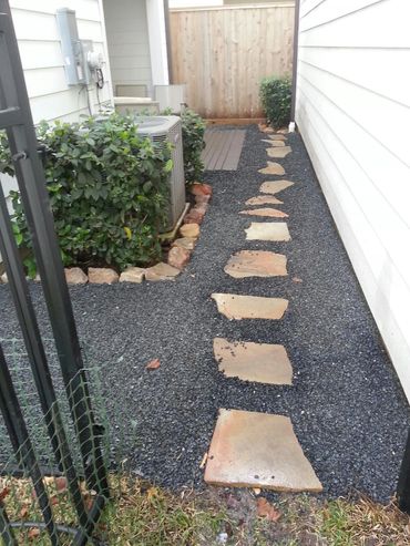 Backyard pathway installation creating easy access through landscaped yard
