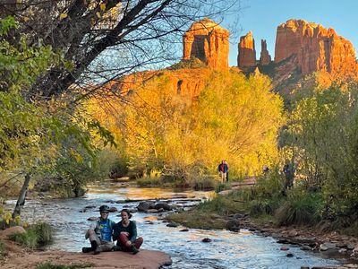 a couple enjoying by a river 