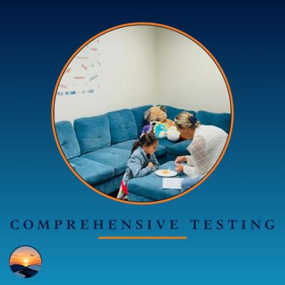 Teacher helping child with testing on a blue couch.