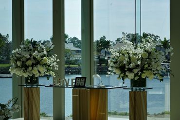 Signing table with beautiful flower arrangements at the Sanctuary Cove Chapel