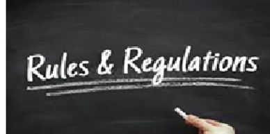 Chalkboard with 'Rules &amp; Regulations' written on it.