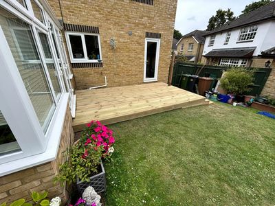 New wooden deck built in backyard.