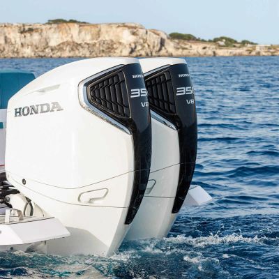 Two Honda 395 V8 outboard motors on a boat in the water.