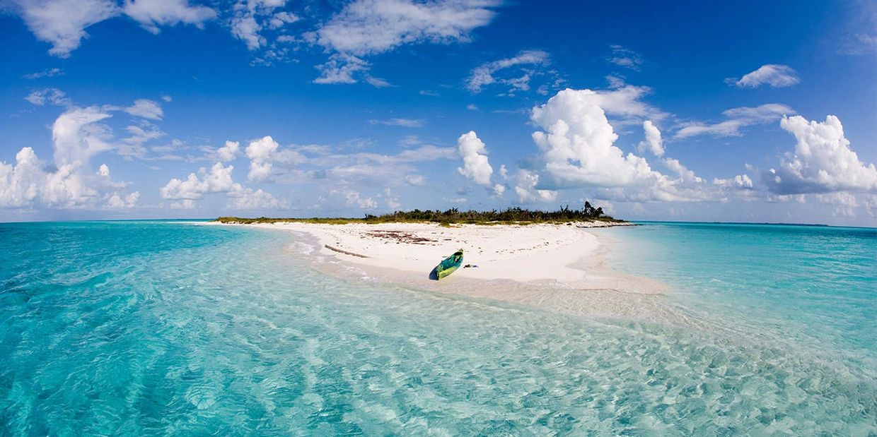 Take a private boat to an excluded sand bar in the Bahamas