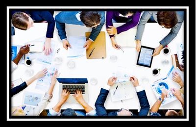 Photo with a view from above of a generic group of people at a board meeting