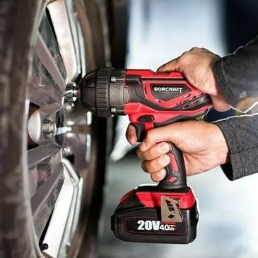 mechanic removing locking wheel nut