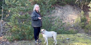 Brenda surrounded by landscape