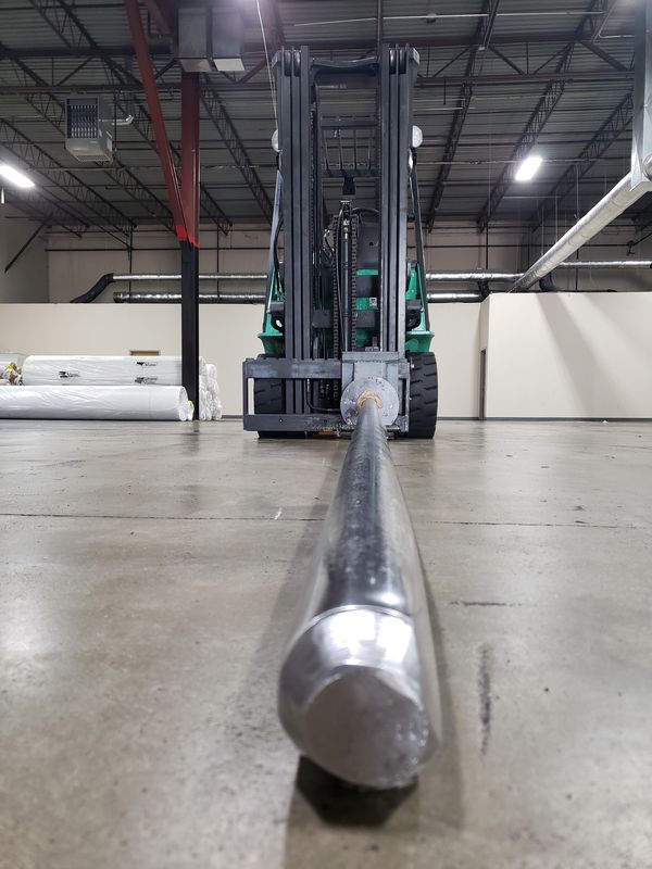 Forklift with a carpet pole attachment