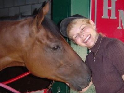 Karen S Davis with thoroughbred friend at Del Mar racetrack.