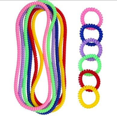 Colorful spiral hair ties arranged in loops.