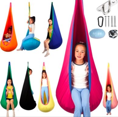 Colorful hanging pod swings with children sitting inside.