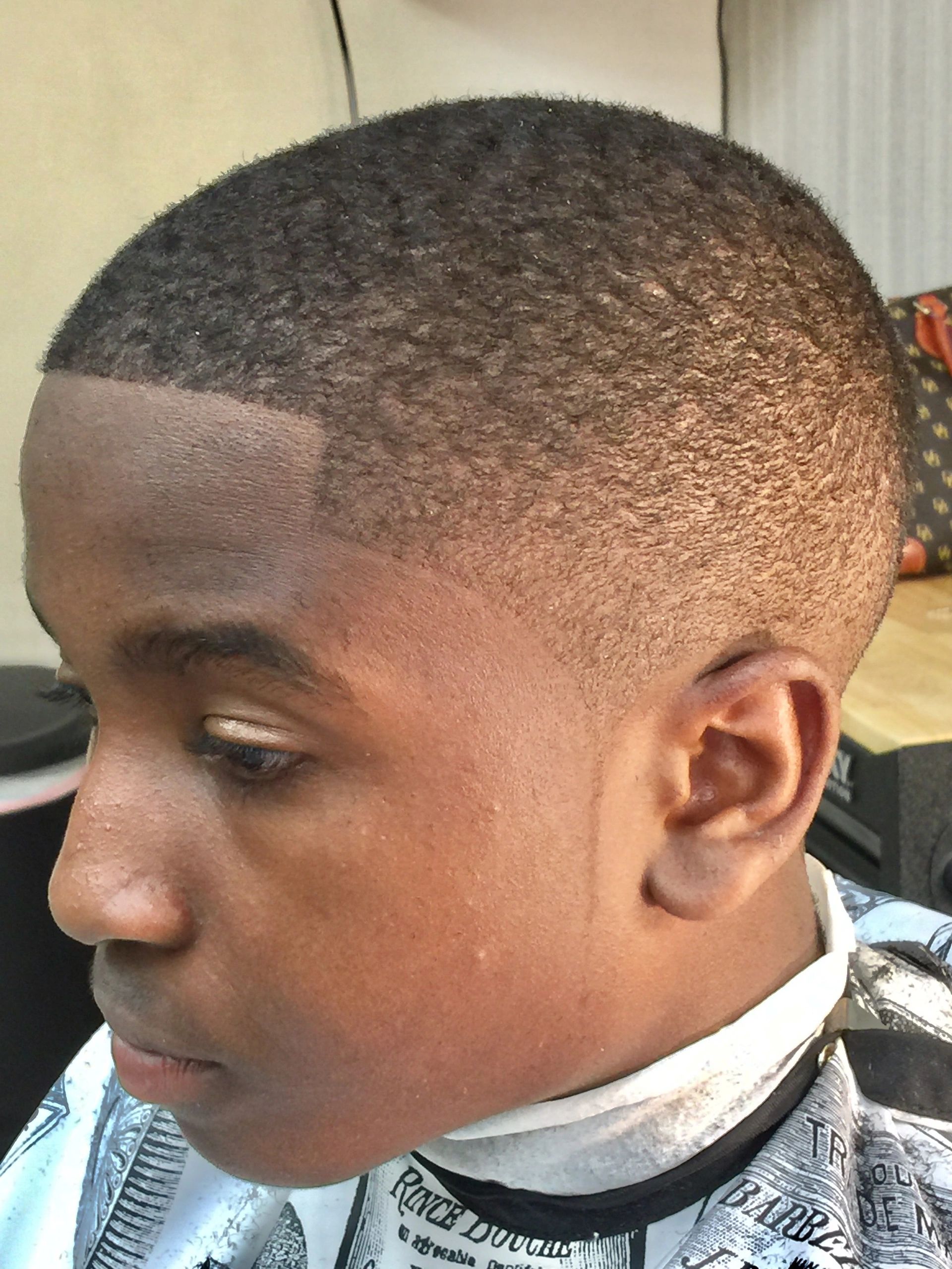 Close-up of a fresh, clean haircut with sharp edges and waves.