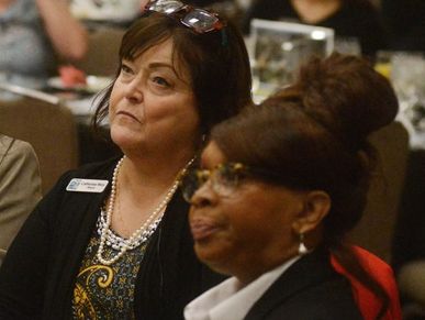 Mayor Moy and Vice Mayor Pam Bertani attentively listening at a formal event.