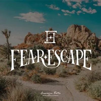 Logo for Fear Escape with desert landscape background.
