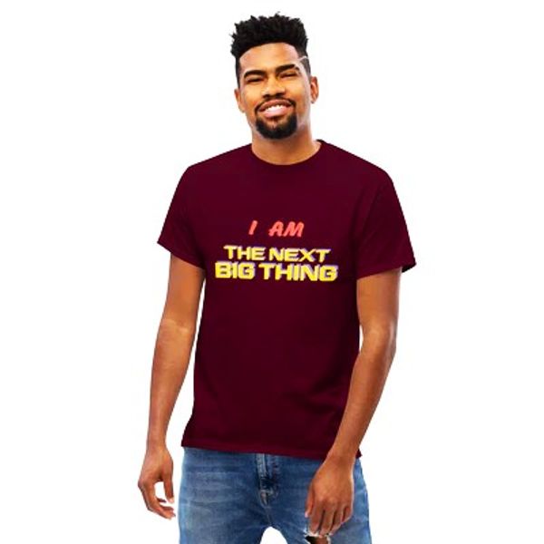 Man wearing a maroon T-shirt with text "I AM THE NEXT BIG THING".