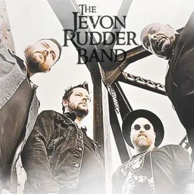 The Jevon Rudder Band members posing under a metal structure, looking down at the camera.
