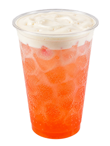 Iced orange beverage with creamy foam on top.