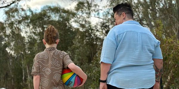 counsellor talking to young boy