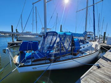 A Hinckley sailboat at the dock