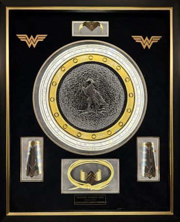 Decorative plaque with Wonder Woman logos and intricate central design.