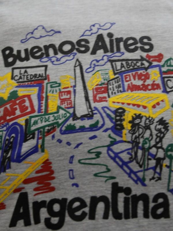 a t - shirt with a drawing of a city