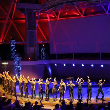 A group of people standing on top of a stage.