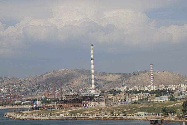 a large factory near a body of water