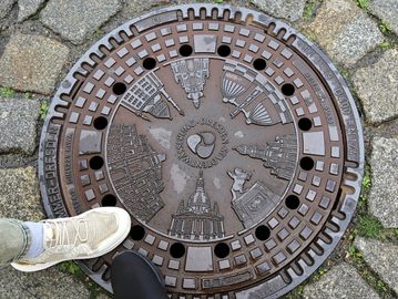 A beautiful manhole with city monuments