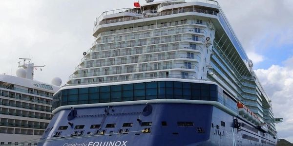 a large cruise ship docked in the water