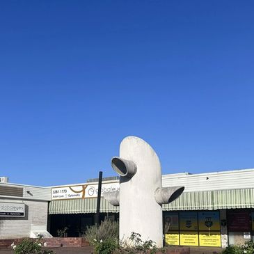Nolans Plaza with a unique sculpture under a clear blue sky. Corporate Space Virtual Offices Ipswich