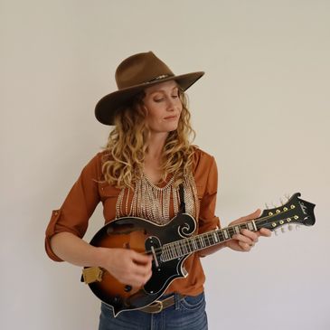 Woman playing a mandolin

