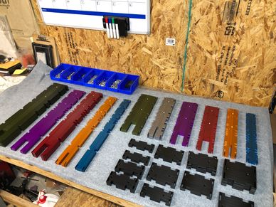 Labeling machine assembly parts - colored for ease of identification. 
