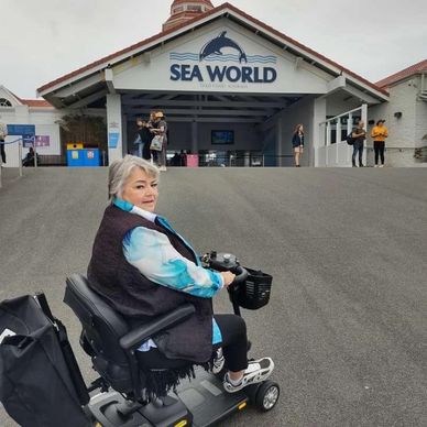 Client on motor scooter at Seaworld