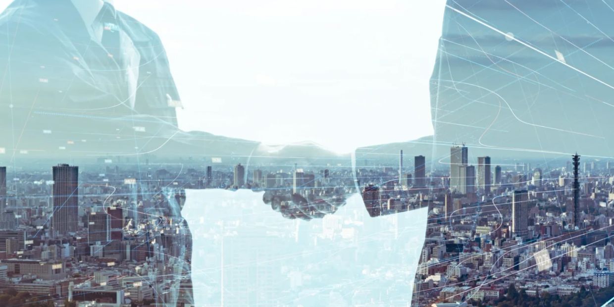 Business handshake over cityscape with digital network overlay.