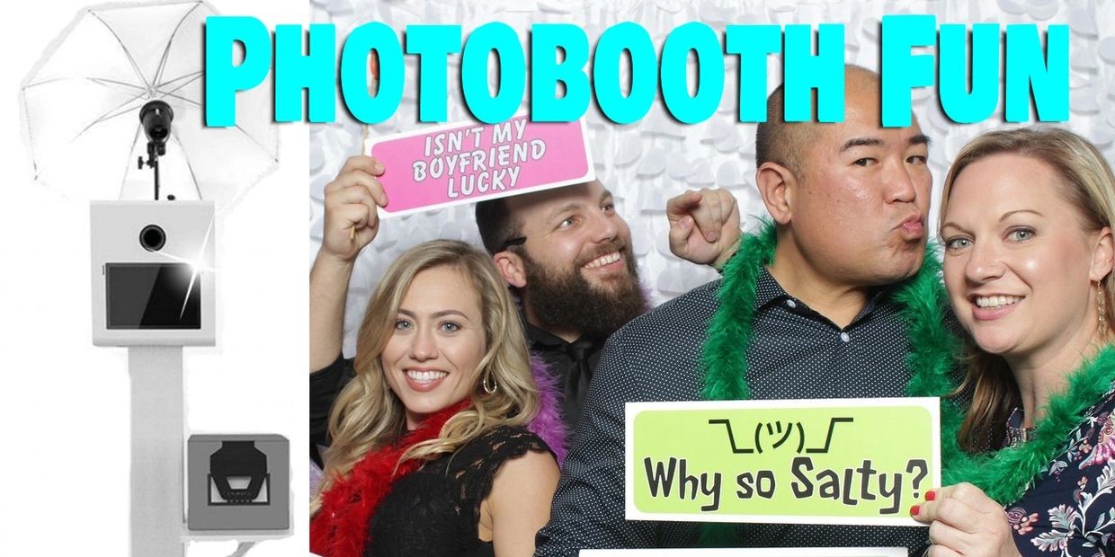 Group of people in a photo booth pose with sign props.