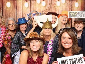 people in Photo Booth holding up signs at a wedding in Jacksonville beach, Florida with Dj's To Go.