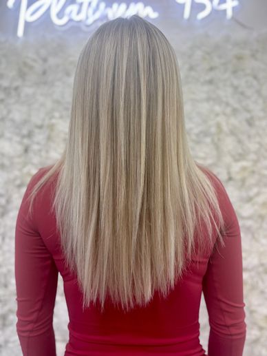 Soft blonde hair color with natural dimension by Platinum 954 Hair Salon