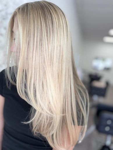 Bright blonde hair color with smooth finish by Platinum 954 Hair Salon