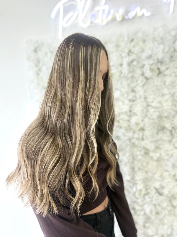 Side view of bronde balayage with face-framing highlights at Platinum 954, Fort Lauderdale.