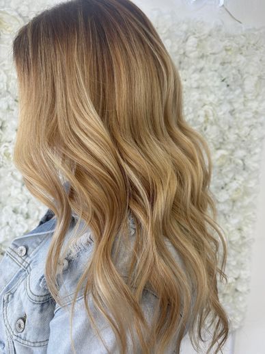Warm blonde balayage hair color by Platinum 954 Hair Salon in Fort Lauderdale