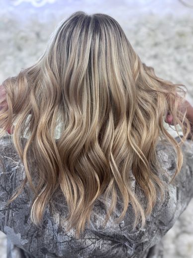 Dimensional blonde hair with highlights and lowlights by Platinum 954 Hair Salon