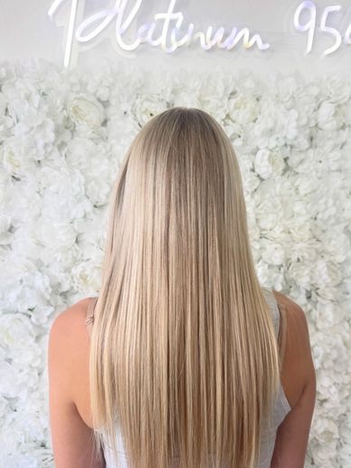 Bright blonde hair color with soft dimension by Platinum 954 Hair Salon