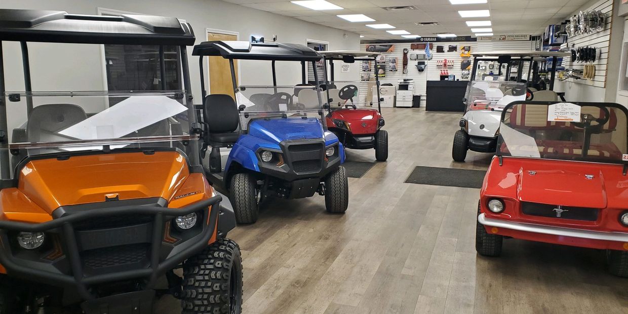 Our colorful showroom of new golf cars, used golf cars and specialty car. 