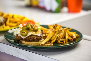  Burger with fries and jalapeños
